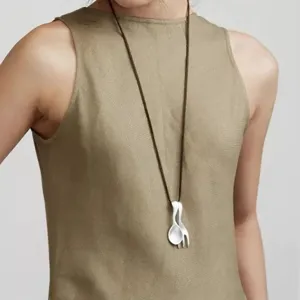 Creative matte silver spoon and fork pendant necklace on minimalist cord