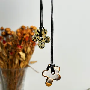 Minimalist long necklaces featuring hollow flower pendants in unique natural stone textures