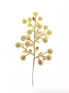Closeup detail of the glittering gold artificial floral branch, delicate star-shaped flower.