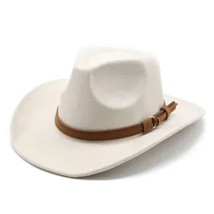 Detail view of off-white felt cowboy hat featuring a brown suede band and buckle