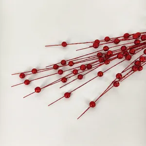 Close-up macro detail of red glitter foam Christmas berry stems for festive holiday decor