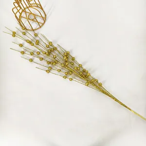 Detailed view of glittery gold berry stem for Christmas holiday floral arrangements