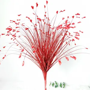 Detailed view of artificial red onion grass with glitter sequins for wedding decor