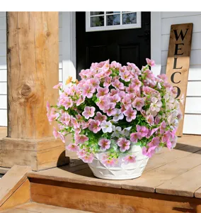 Artificial wildflower potted plant detail on wooden porch scene for home decoration.