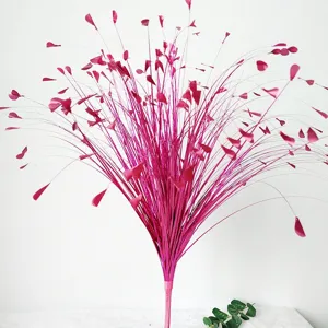 Detailed view of vibrant magenta glitter artificial onion grass for wedding decoration
