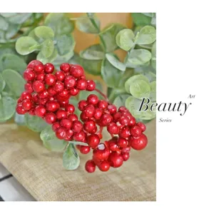 Close-up of decorative artificial red berry clusters for festive candle ring decor