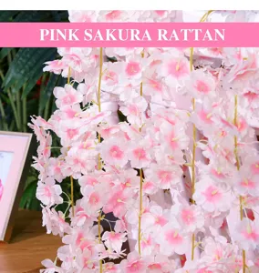 Artificial pink cherry blossom rattan hanging flower for wedding decoration and home wall decor detail.