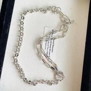 Detailed view of vintage S925 silver necklace featuring mixed round and long chain links