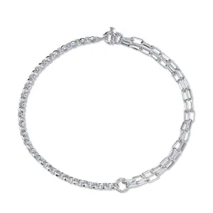 Detail view of a vintage silver-colored necklace featuring a mixed chain design.