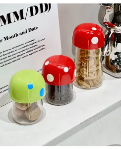 Macro detail of cute mushroom-shaped food storage jars with red and green dotted lids