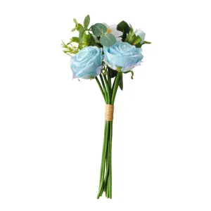 Detailed view of a light blue artificial rose bouquet with green leaves and tan string tie.