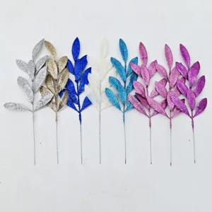 Assorted multi-colored glitter artificial leaf sprigs for festive Christmas DIY decoration