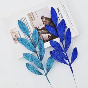 Two branches of artificial glitter leaves in blue and cyan for DIY holiday decoration