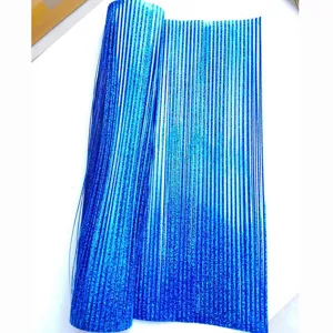 Close-up of blue laser PVC fringe grass with glitter finish for party decoration