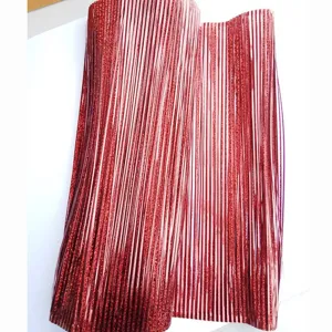 Macro detail of red glitter tinsel fringe curtain for Christmas party decoration