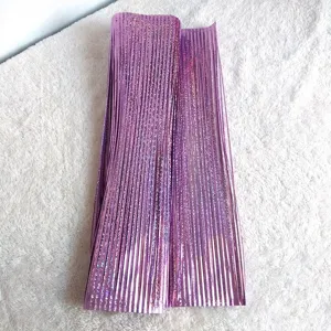 Detail view of purple laser holographic PVC fringe streamers for Christmas party decor.