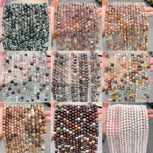 Diverse collection of natural phantom quartz and crystal beads for DIY jewelry making.
