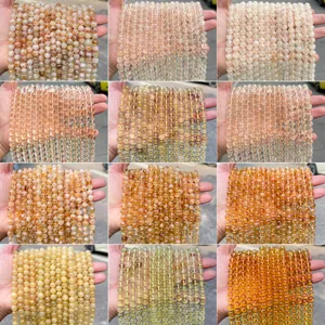 Detailed macro view showing various shades of natural 8mm citrine round beads for DIY