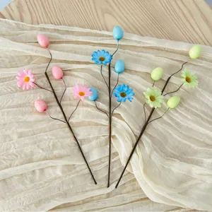 Easter egg and daisy floral picks with pastel speckled eggs for festive spring decor