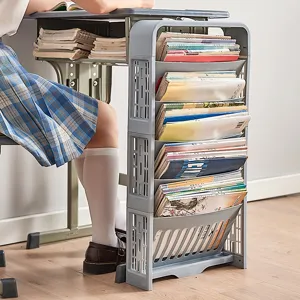 Multi-tier grey desk side storage rack for books and school supplies in classroom scene.