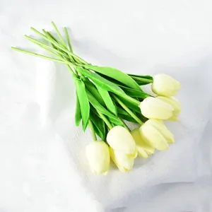 Macro view of cream-colored artificial tulips with soft touch moisturizing texture