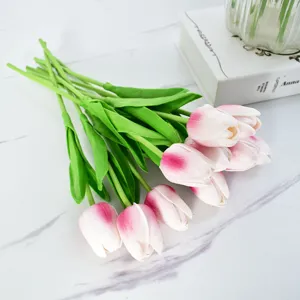 Detail of realistic pink and white artificial tulips with soft moisturizing texture