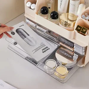 Elegante cosmetische organizer in crème en transparant voor op de kaptafel opslag.