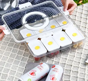 Detail showing a clear portable fruit storage box with multiple white compartments.
