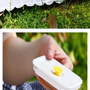 Close-up of the vacuum seal valve on white plastic lid for outdoor fruit storage box