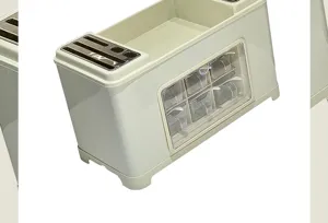 Detail view of kitchen seasoning box with stainless steel knife slots and clear spice drawers