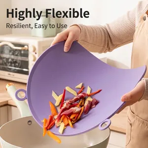 Flexible purple TPU cutting board being used to pour ingredients into a pot.