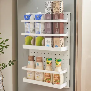 White plastic wall-mounted pegboard shelf organizer for kitchen and refrigerator storage