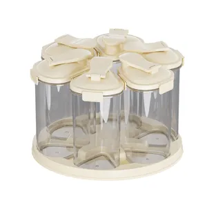 Rotating seasoning storage jars set with 6 clear plastic containers on a cream base