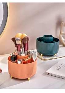 Detail of rotating makeup brush organizer with ribbed texture on a vanity table