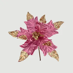 Detailaufnahme einer rosa künstlichen Weihnachtstulpe mit funkelnden goldenen Pailletten