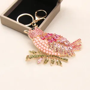 Vintage rhinestone magpie bird keychain and bag charm featuring sparkling pink crystals