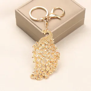 Elegante gouden pauw sleutelhanger met fonkelende strass steentjes voor tassen