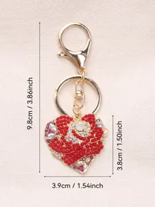 Detailed view of red rhinestone heart keychain with dimensions: 9.8cm height and 3.9cm width.