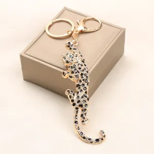 Exquisite vintage alloy leopard keychain with sparkling rhinestones shown on a gift box