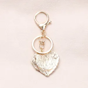 Elegant gold-plated heart-shaped keychain with sparkling texture for bag accessory gift