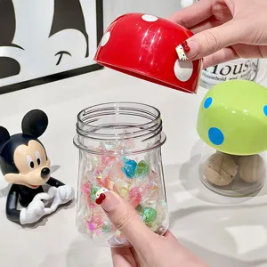 Mushroom-shaped clear plastic storage jar with red polka dot cap for kitchen food
