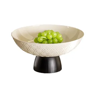 Corbeille à fruits ronde de luxe moderne avec socle noir et motif de losanges en relief crème