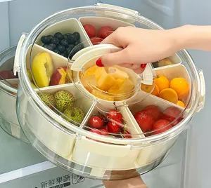 Detailed view of a 6-compartment food storage container being lifted by its handle.