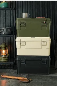 Stackable heavy-duty camping storage boxes in olive green, beige, and black for outdoor use.