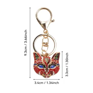Detailed view of vintage fox mask keychain with rhinestones and precise size measurements