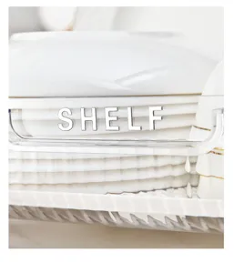 Detailed view of luxury transparent kitchen shelf organizer with silver metal SHELF logo