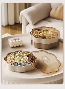 Detail showing the internal compartments of the flower-shaped nut box with various snacks.