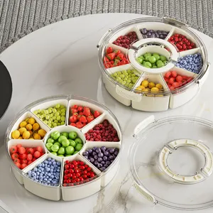 Transparante draaibare fruitschaal met 9 compartimenten en handvat voor snacks