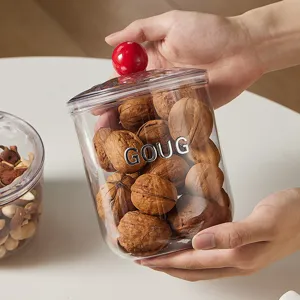 Barattolo ermetico trasparente con pomello rosso per noci o chicchi di caffè