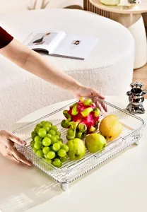 Detailed macro shot of a clear rectangular plastic tray featuring a white drainage base.